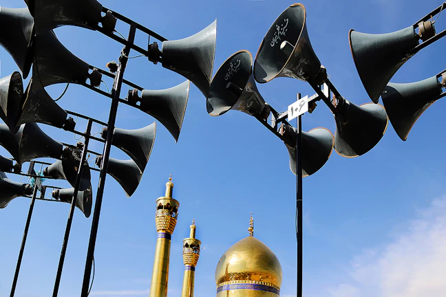 A beautifully installed mosque sound system with elegant speakers mounted near the ceiling.