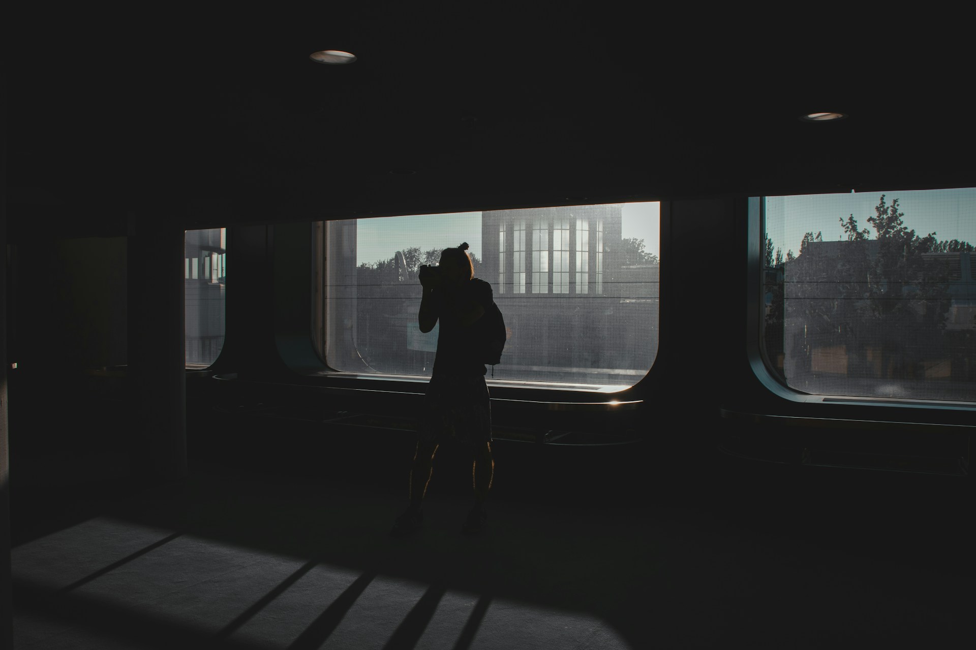a person taking a picture of a building through a window