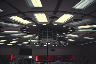 a group of people standing around a room