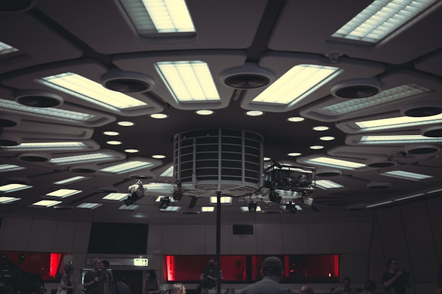 a group of people standing around a room