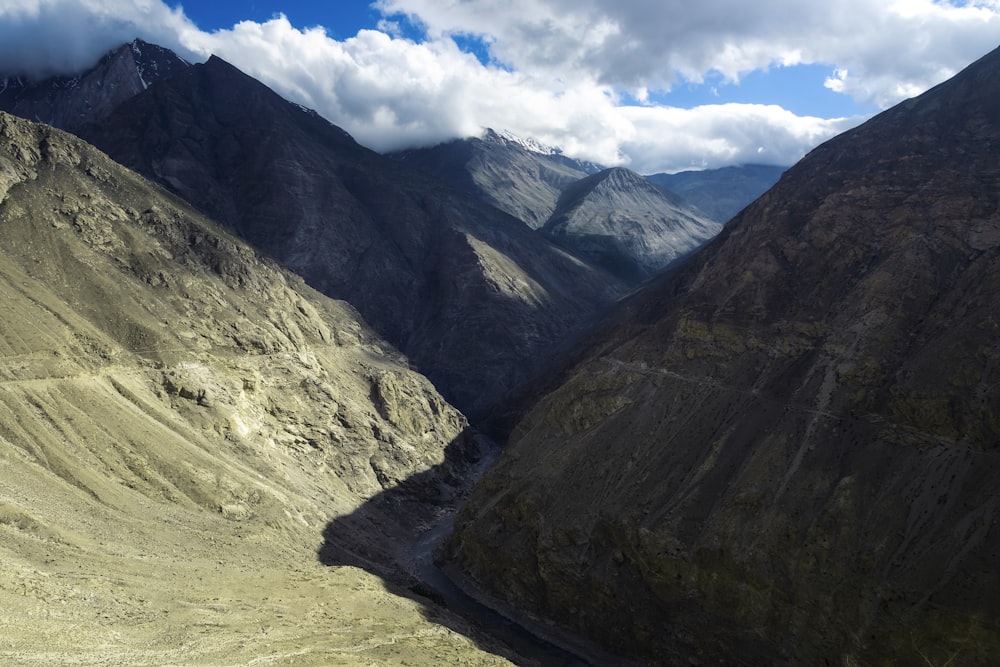 a view of a valley with mountains in the background