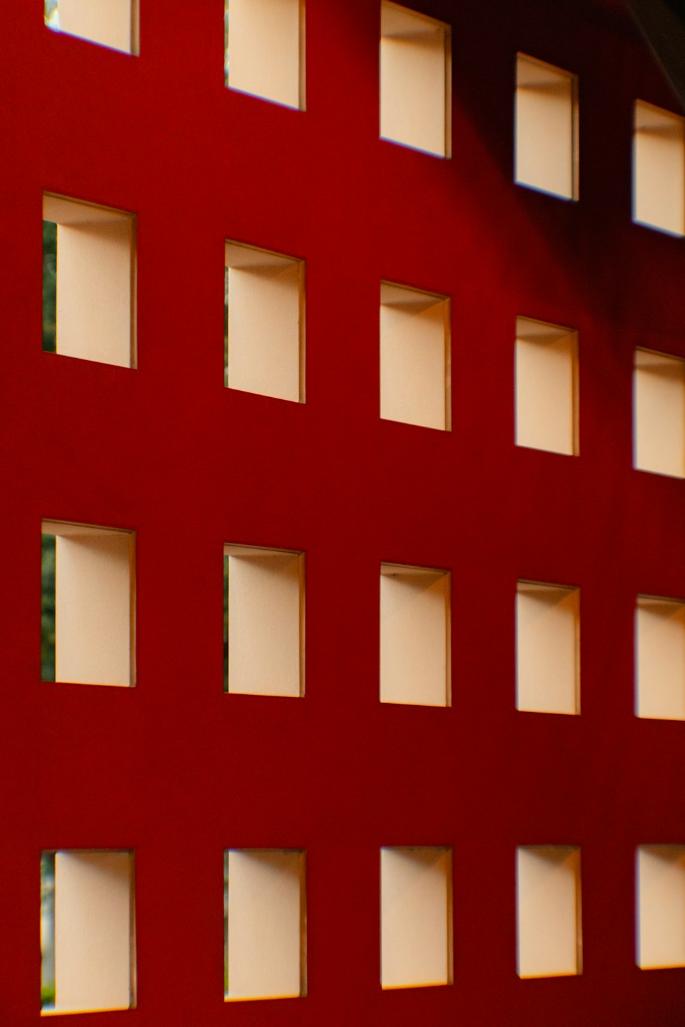 a red building with many windows and a clock