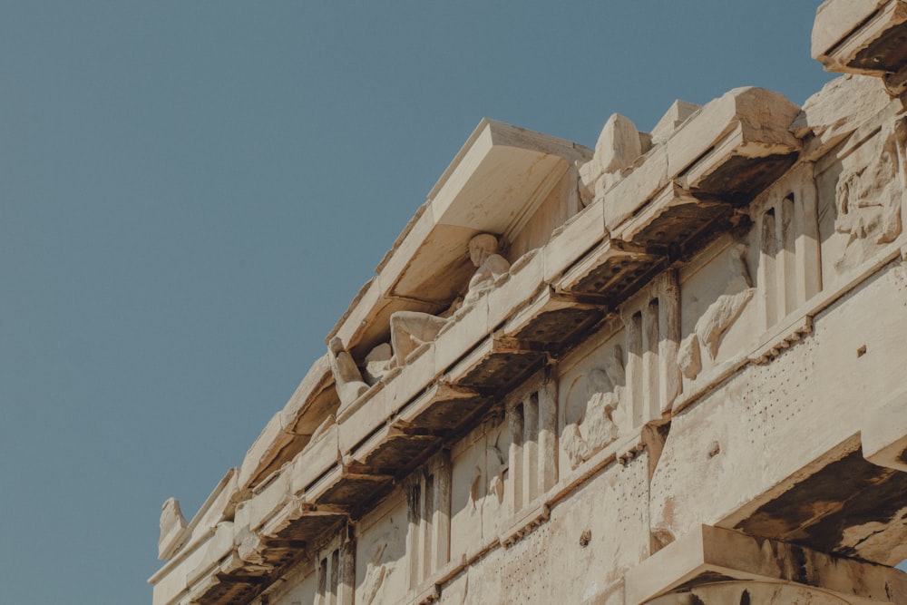 a close up of a building with a sky in the background