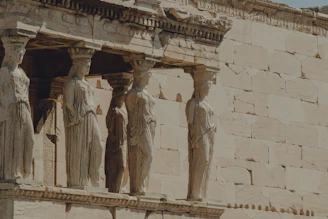 a group of statues on the side of a building