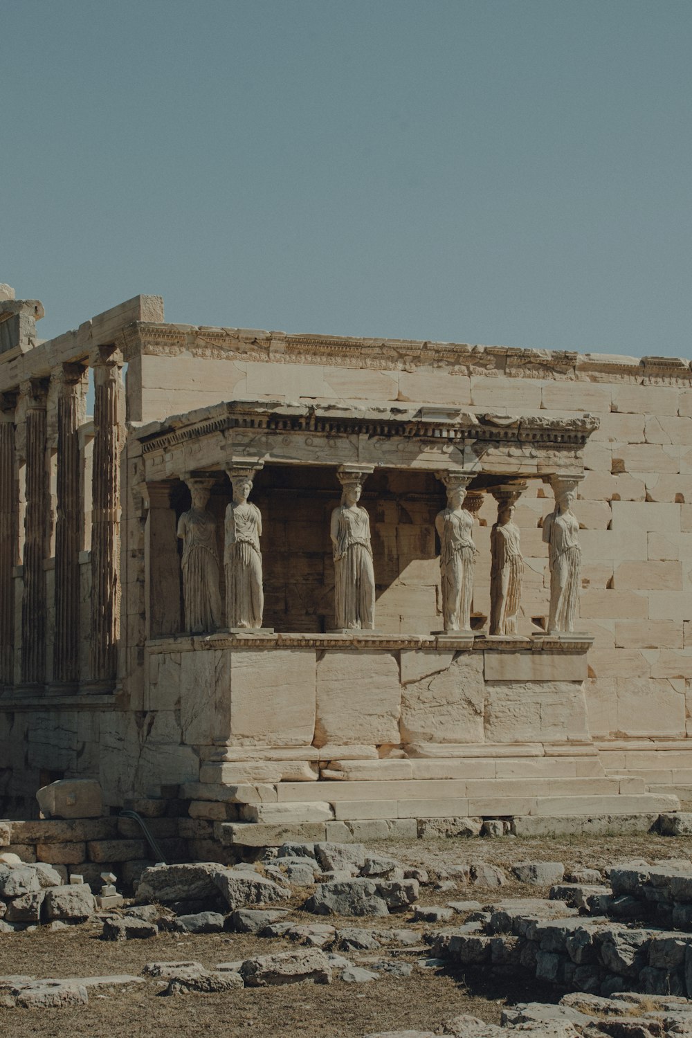 a group of statues on the side of a building