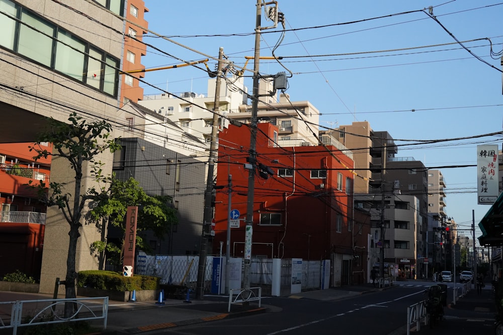 a city street lined with tall buildings and power lines