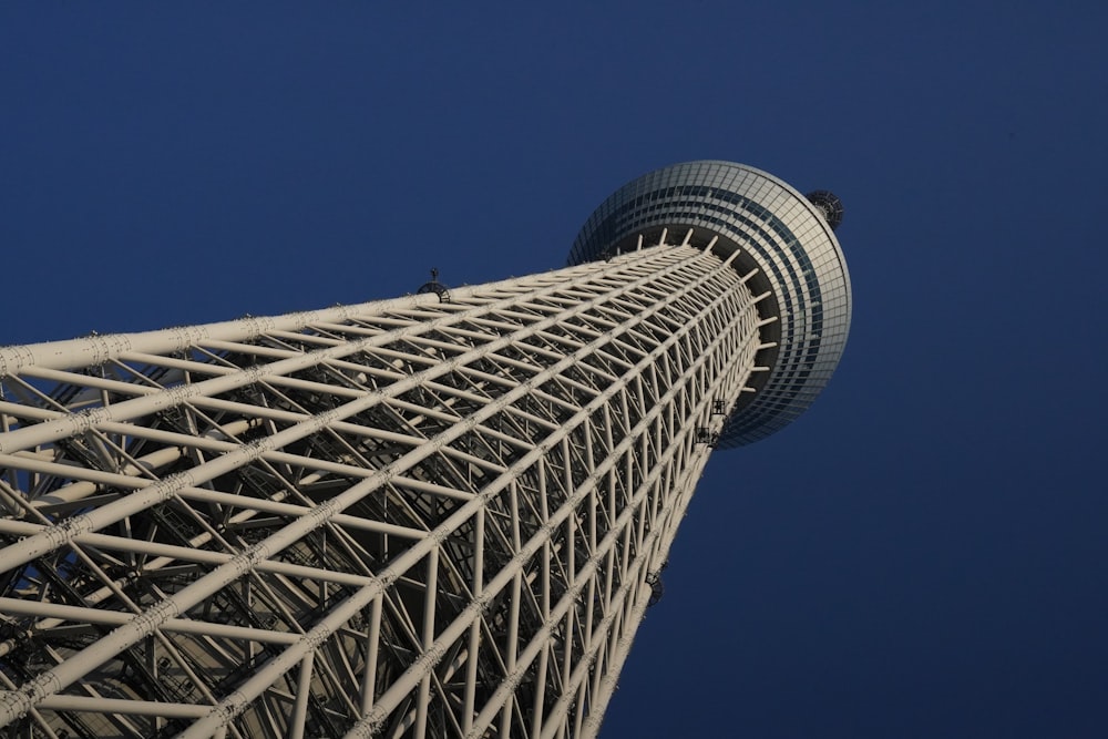 the top of a tall building with a sky background