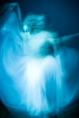 A dancer moving fluidly, capturing the essence of body as a hologram.