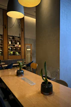 Cozy Scandinavian-style restaurant scene with a team planning marketing content around a table