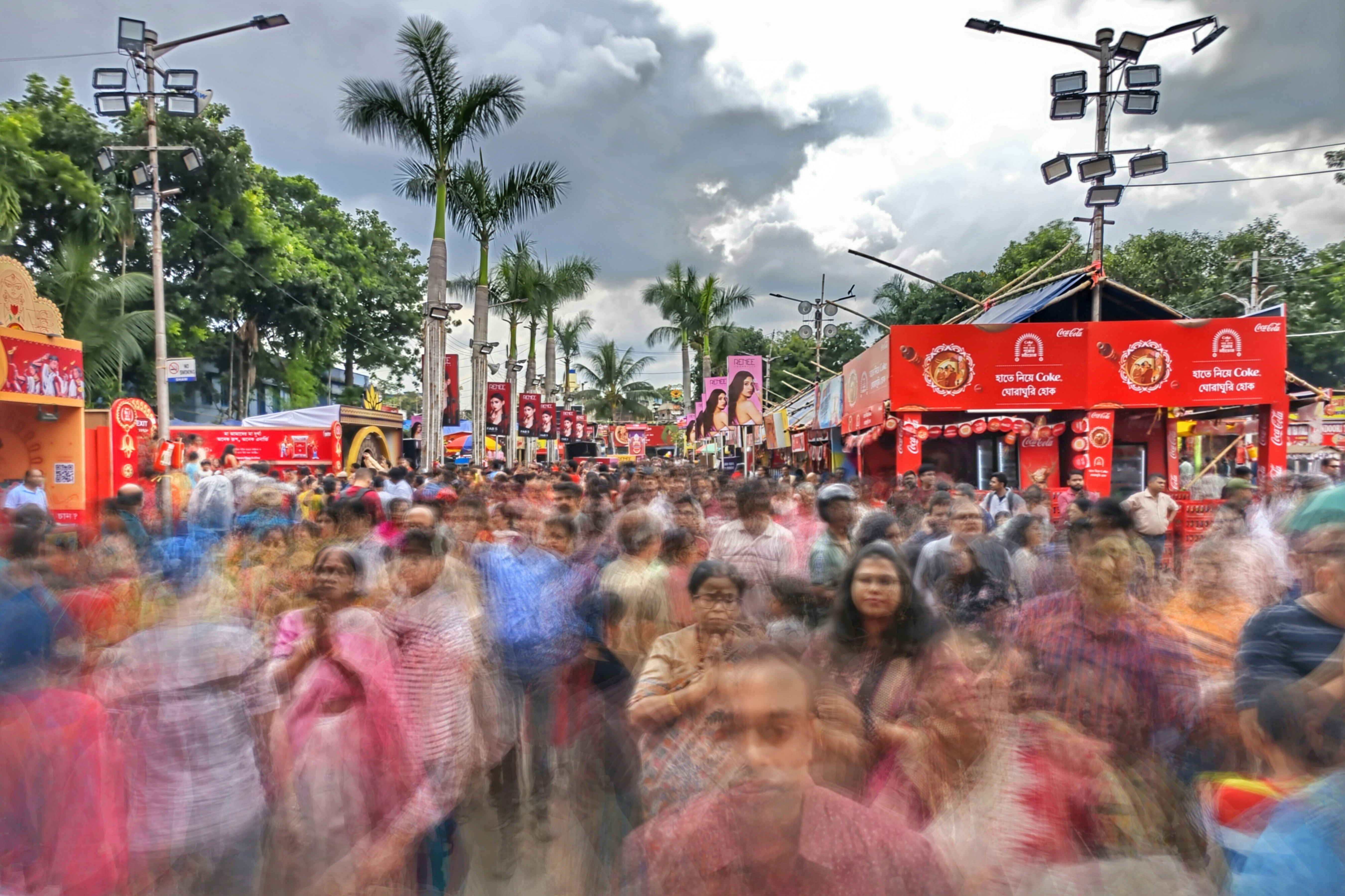 a large group of people walking down a street