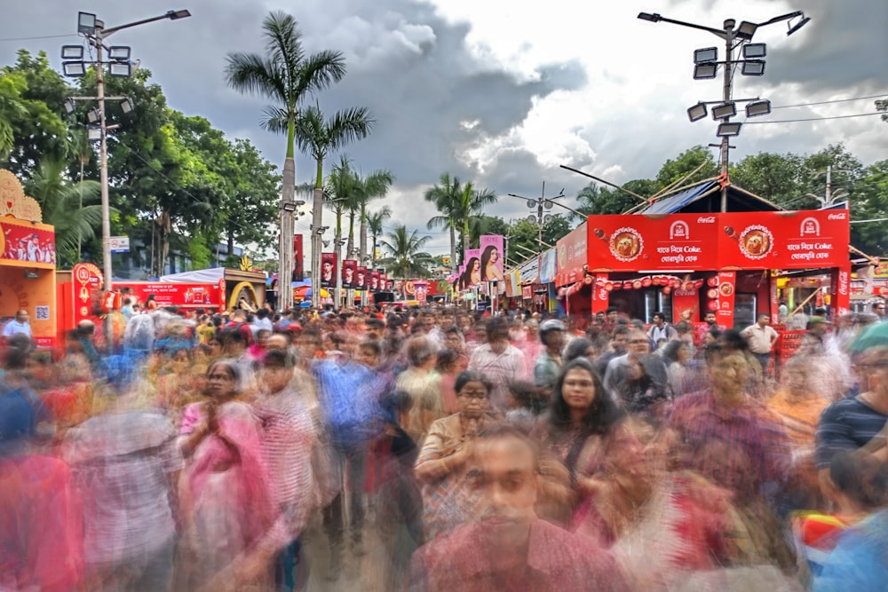 a large group of people walking down a street