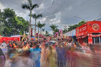 a crowd of people walking down a street