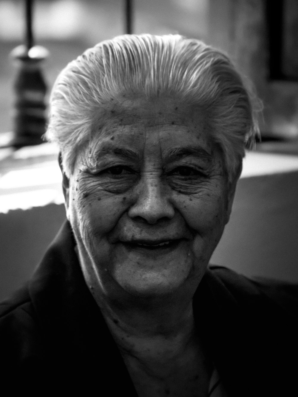 a black and white photo of an older woman