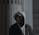a man wearing a hoodie and glasses