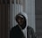 a man wearing a hoodie and glasses