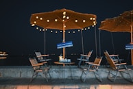 Airbnb rental container setup with outdoor seating and warm lighting at dusk.