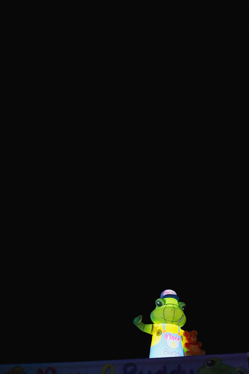 a cartoon character standing in front of a black background