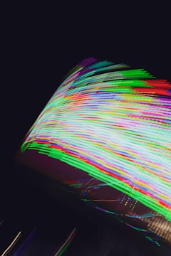 Vibrant music waveforms glowing in neon colors.