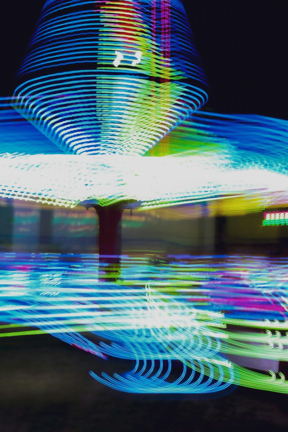a blurry photo of a carousel at night