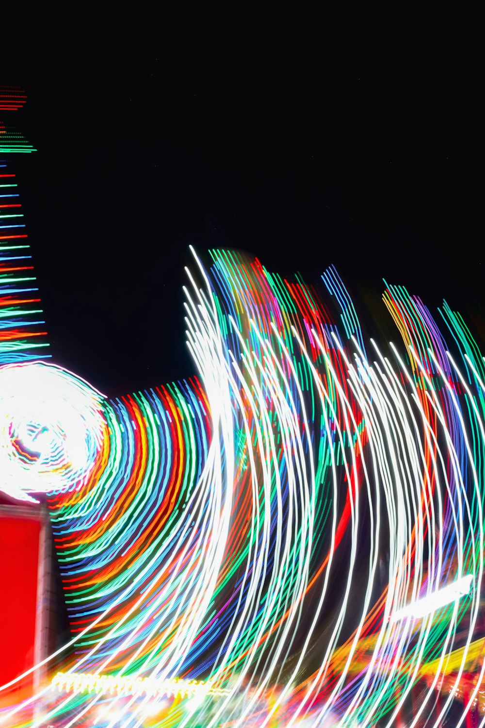 a blurry photo of a clock tower at night