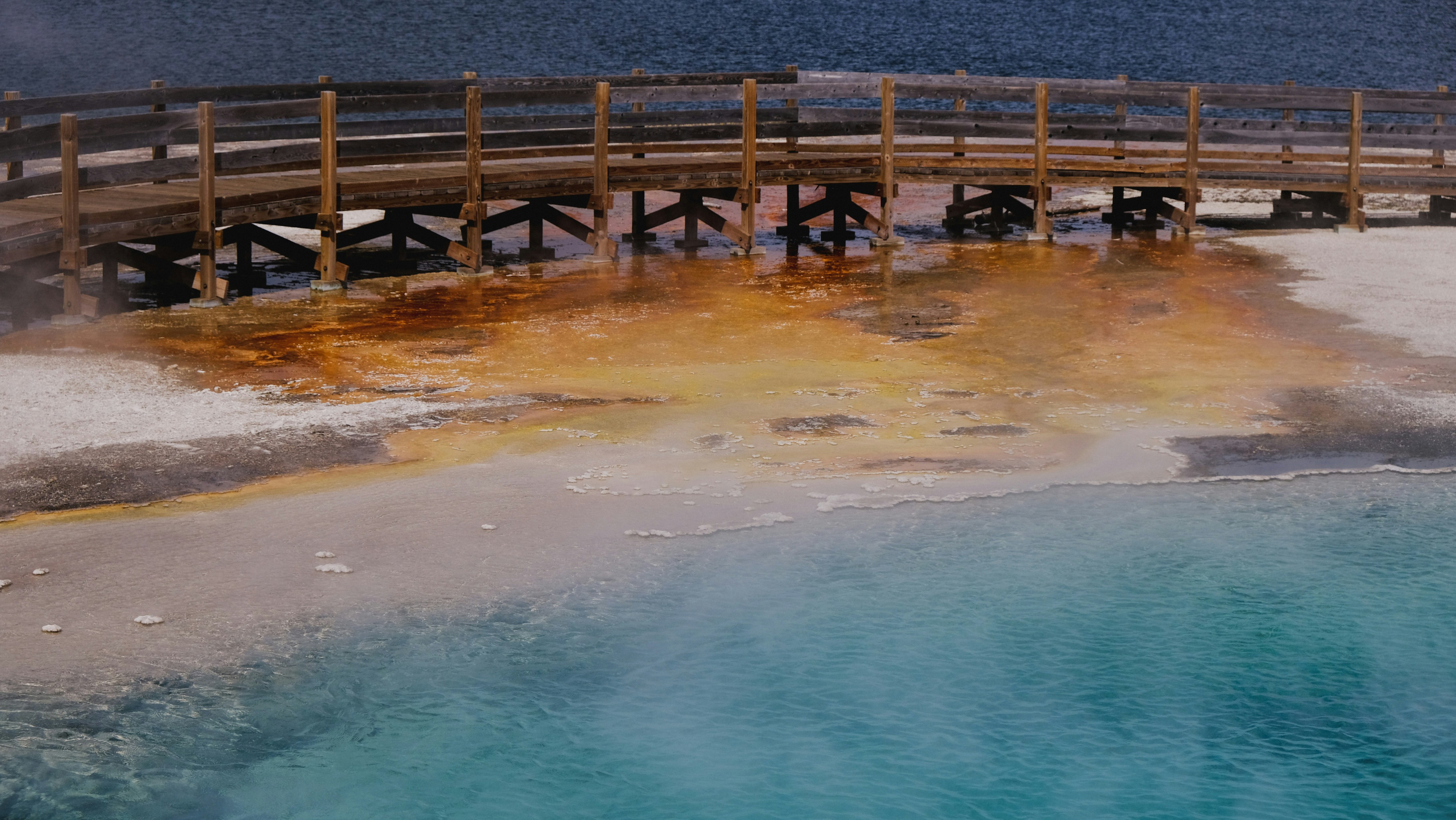 a wooden bridge over a body of water