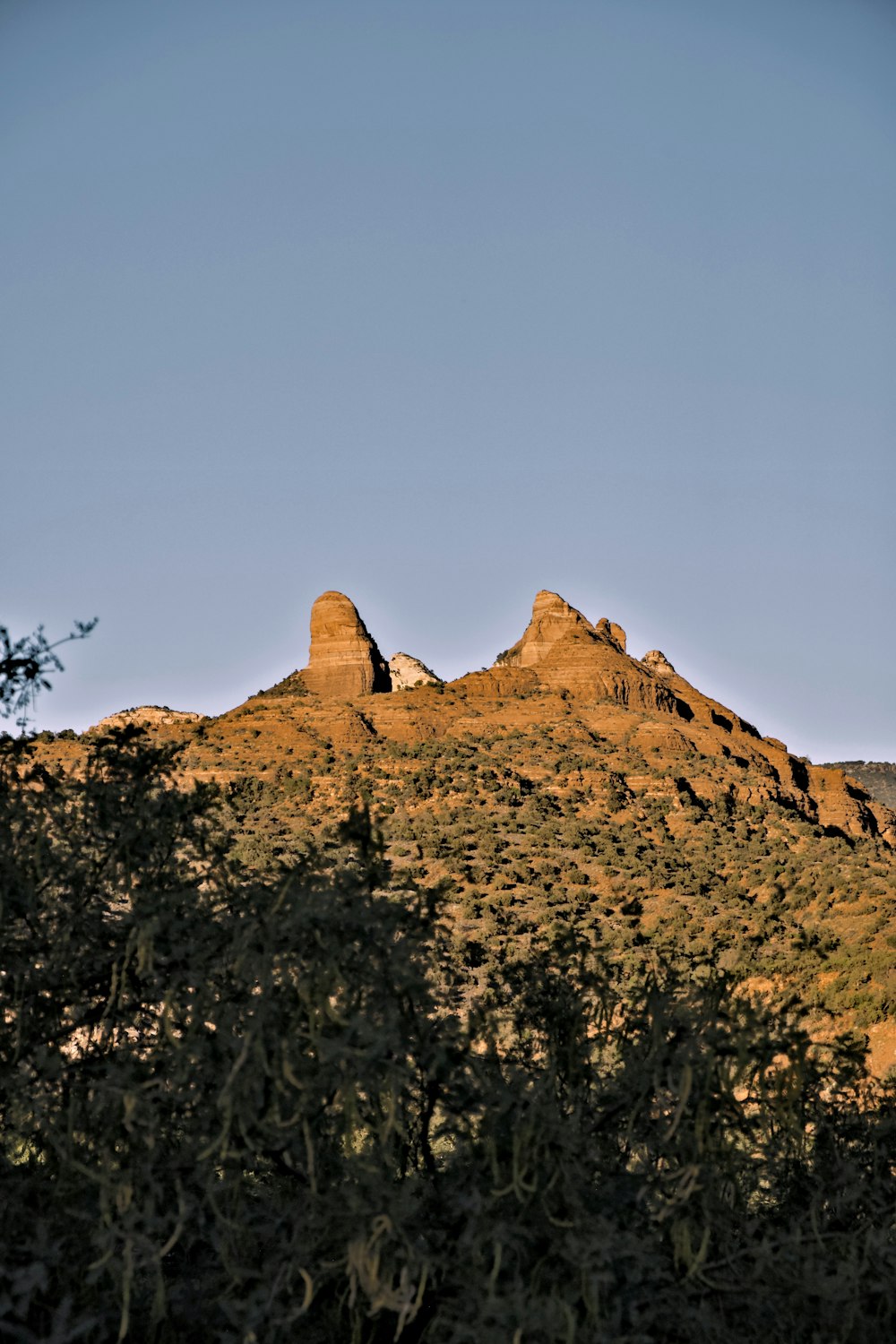 a mountain with a few rocks on top of it