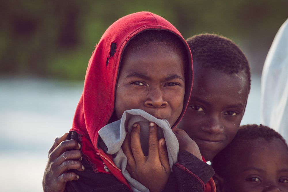 a group of young children standing next to each other