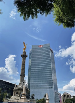 a tall building with a flag on top of it