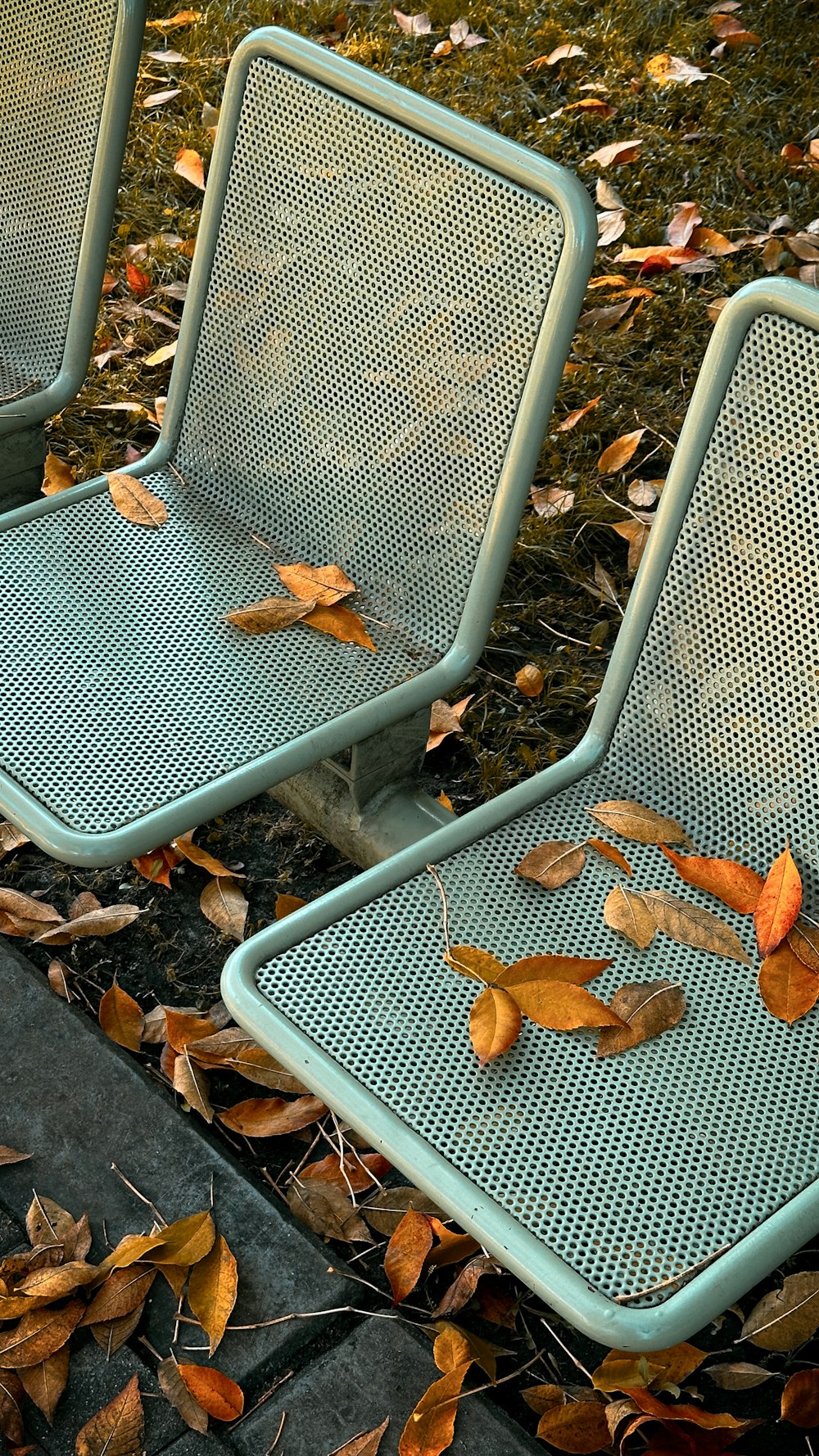 a couple of blue chairs sitting next to each other