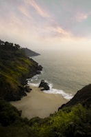 a view of the ocean from the top of a hill