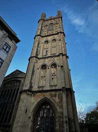 a tall tower with a clock on the top of it