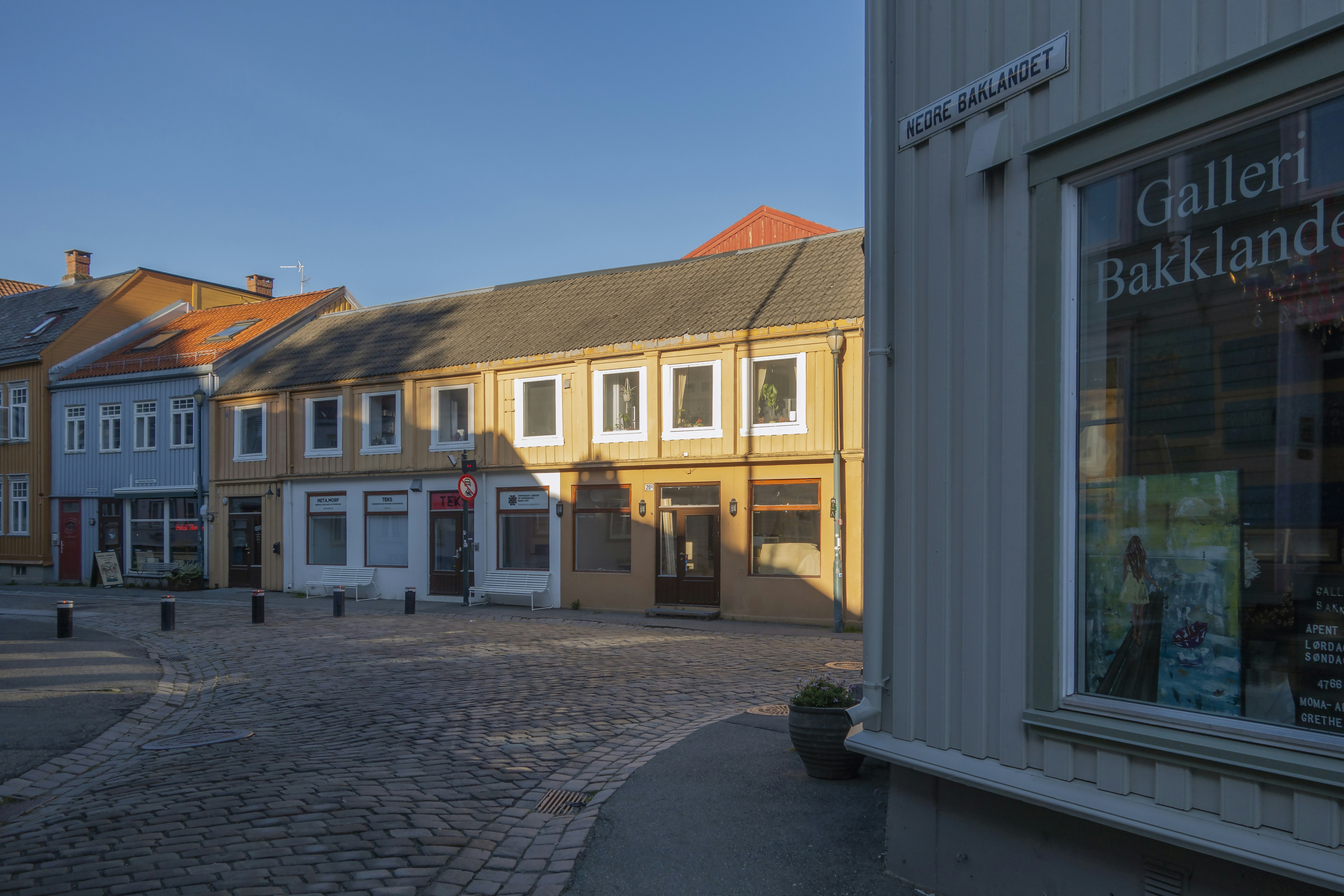 a cobblestone street in a small town