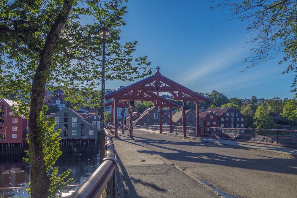 a bridge over a body of water with buildings in the background