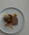 A beautifully plated roast duck dish served in an elegant restaurant.