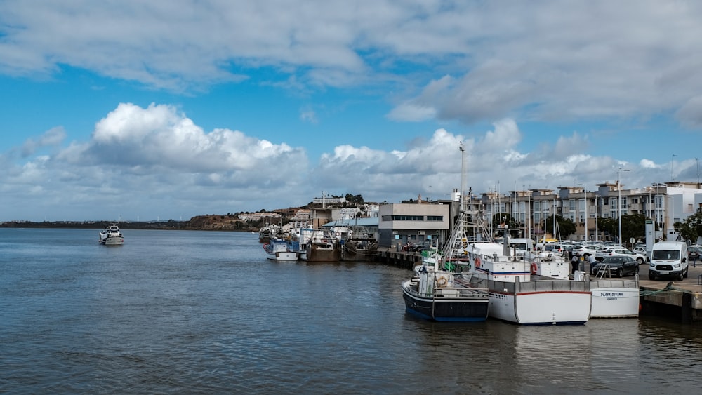 a group of boats that are sitting in the water