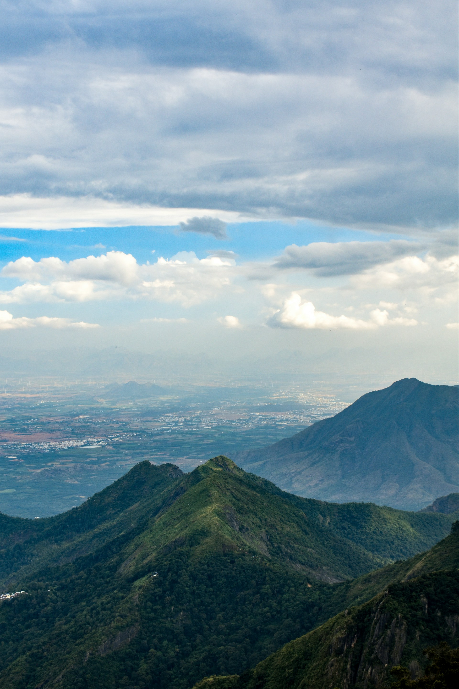 a view of a valley and mountains from a high point of view