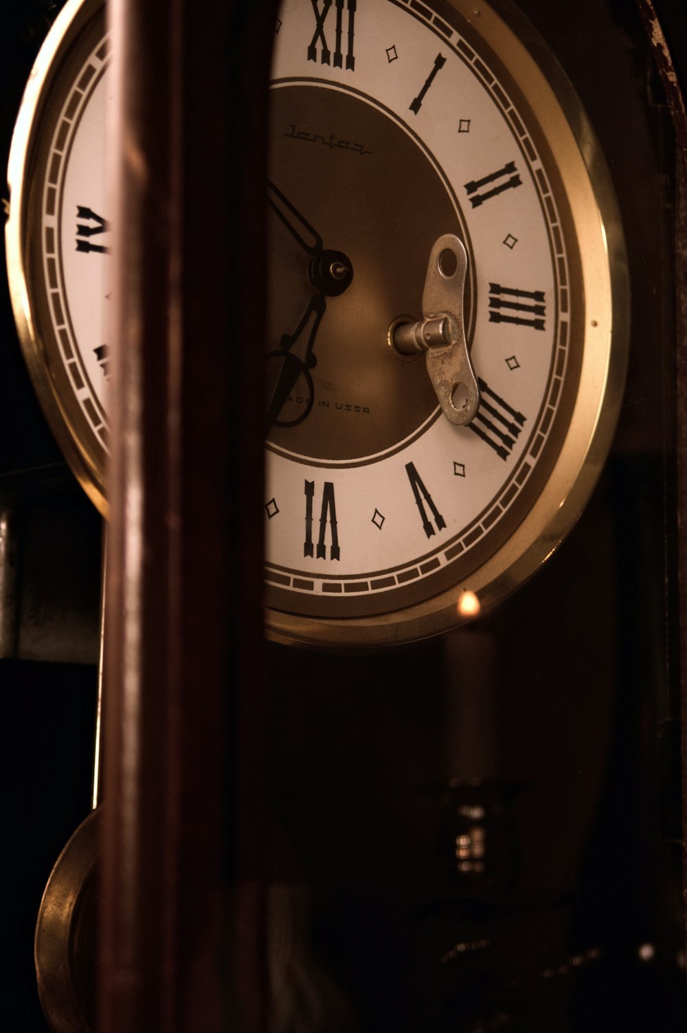 a close up of a clock with roman numerals