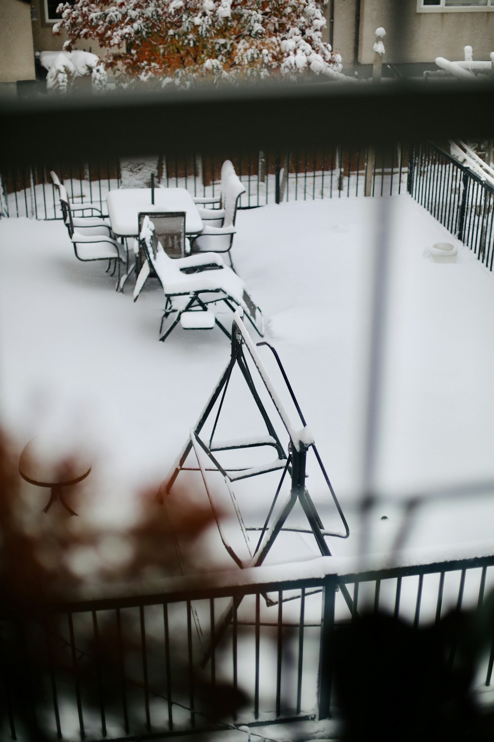 a view of a snow covered yard from a window