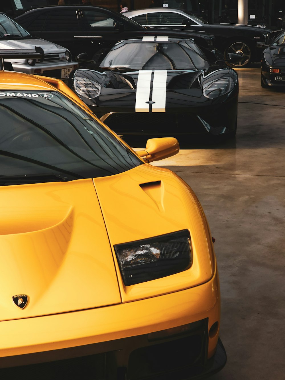 a yellow sports car parked in a garage