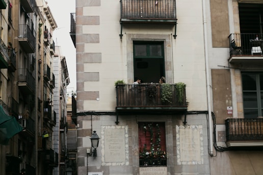a tall building with a balcony and balconies