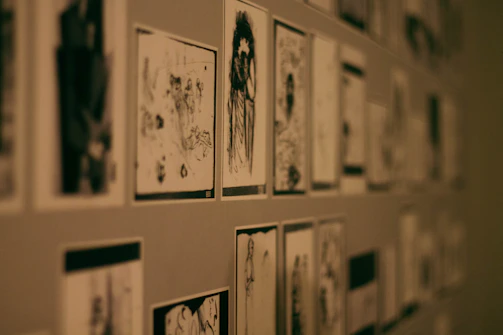 Storyboard sketches pinned on a dark wall with film grain texture overlay.