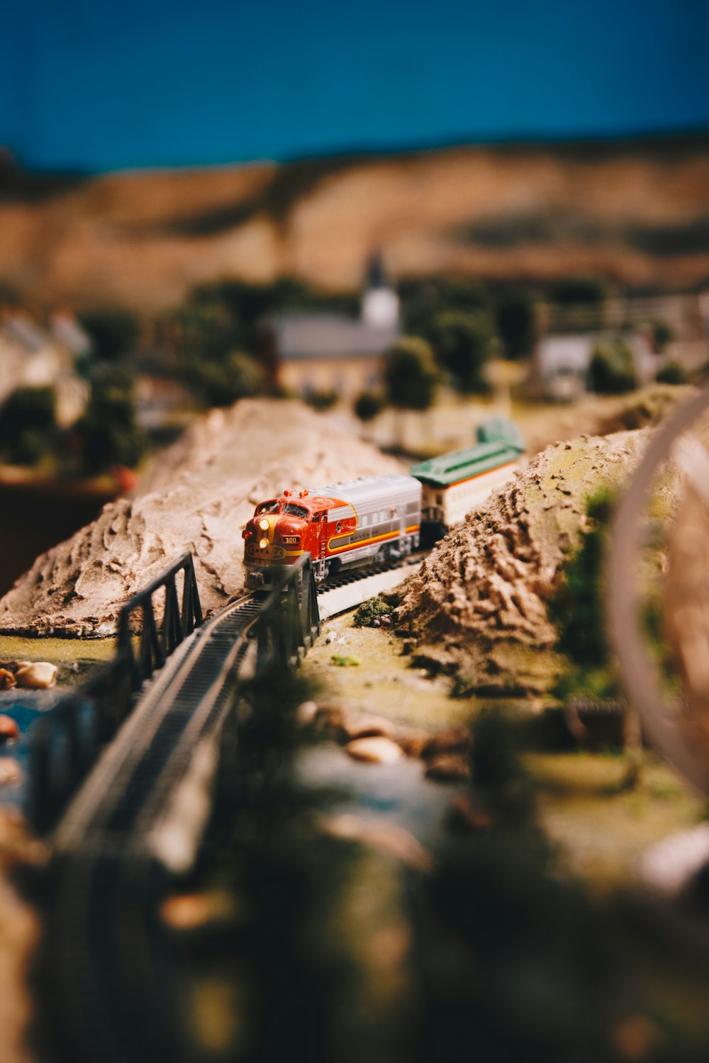 a model of a train traveling over a bridge