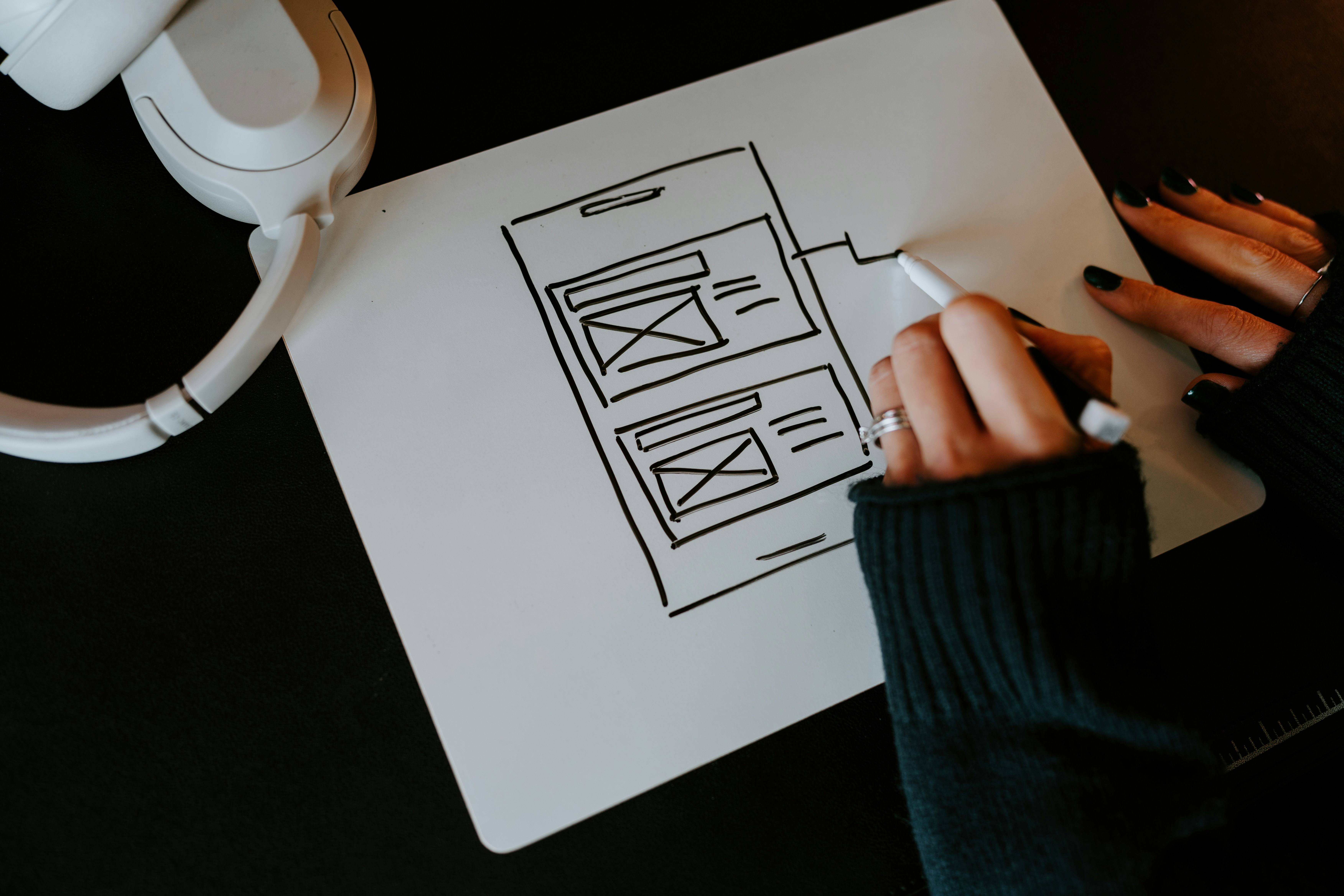 a person writing on a piece of paper