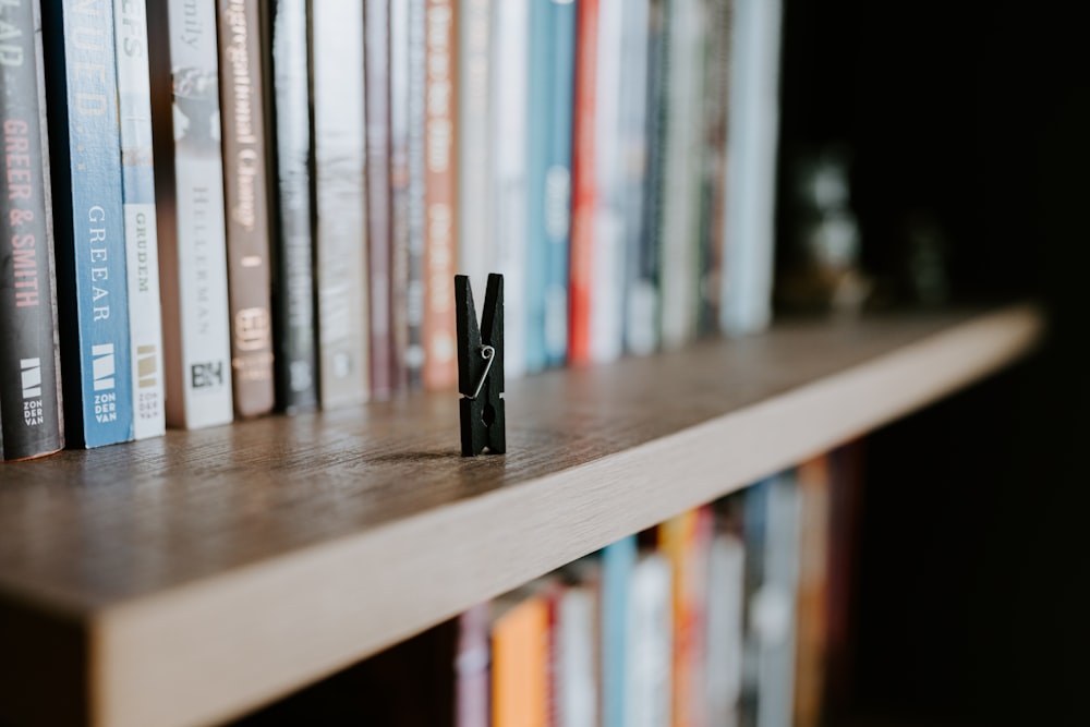 a bookshelf with a couple of books on top of it