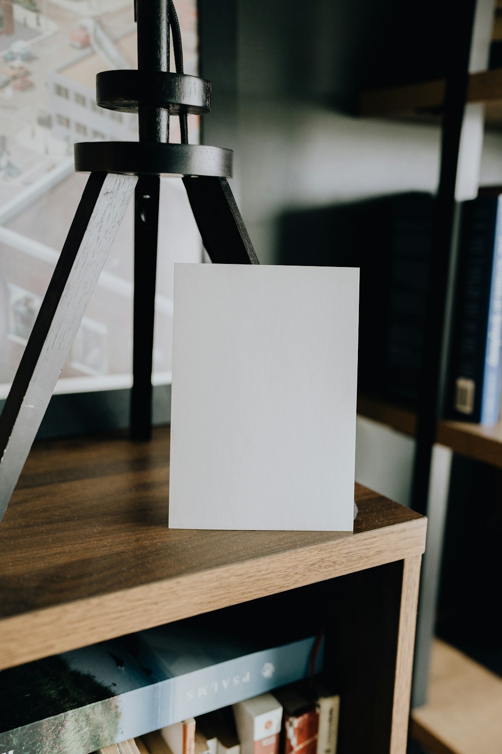 a blank card sitting on top of a wooden table