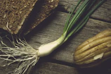 Natural ingredients arranged artfully on rustic wooden surface.