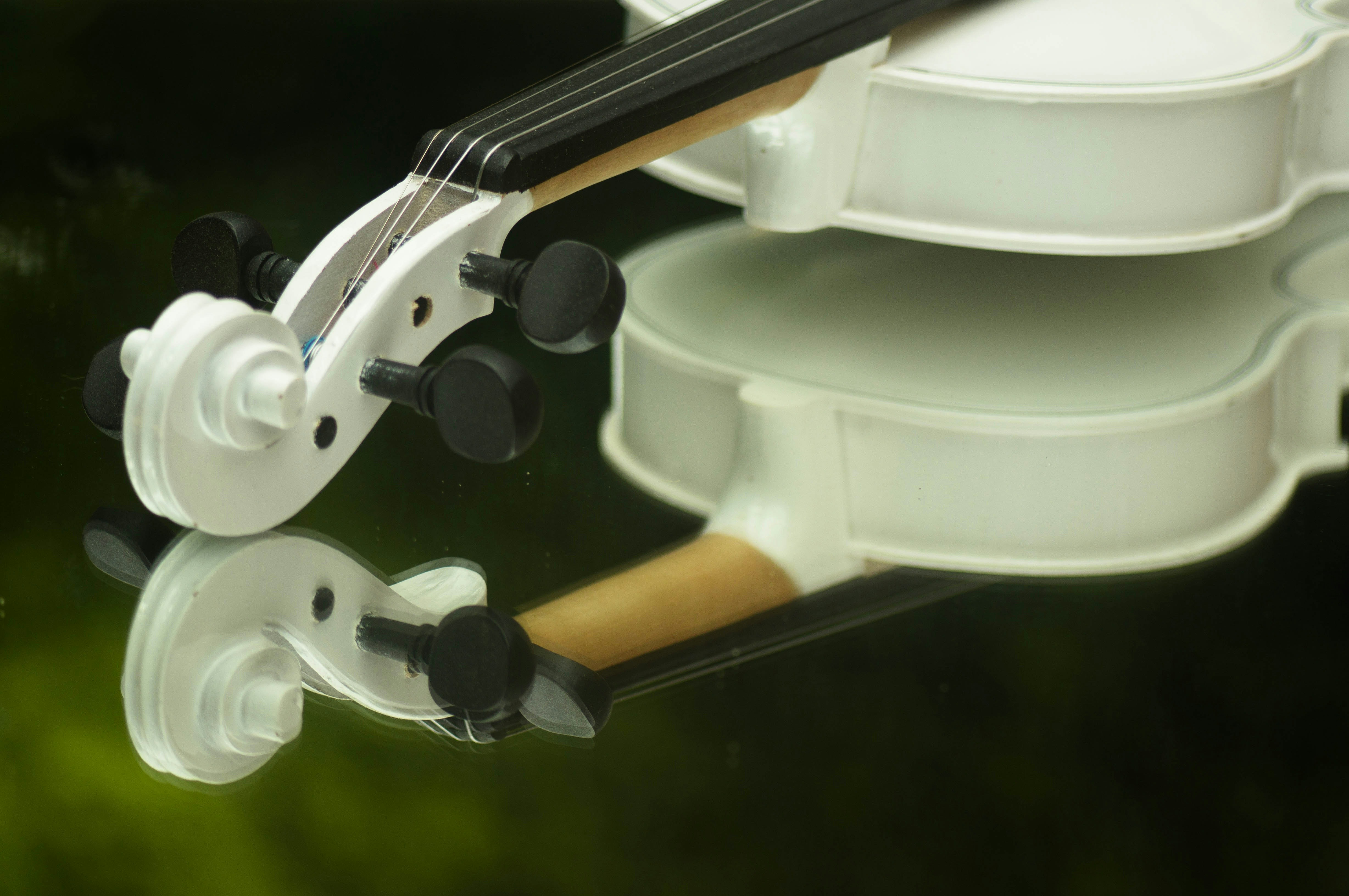a close up of a violin on a table