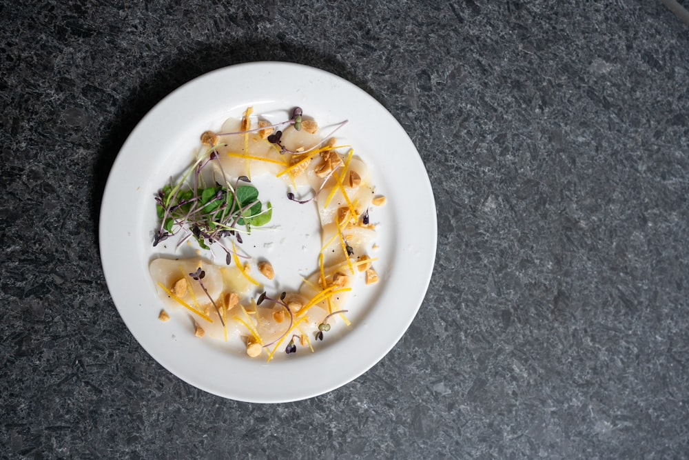 a white plate topped with food on top of a table