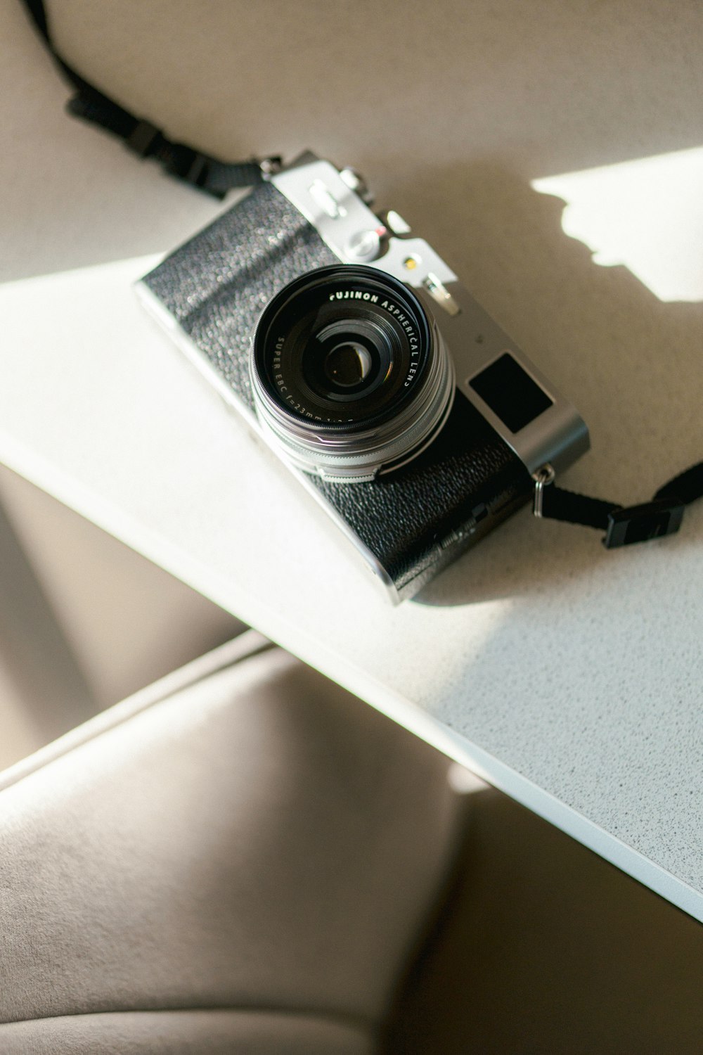 a camera sitting on top of a white table