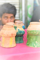 A collection of colorful polymer clay creations displayed on a white table.